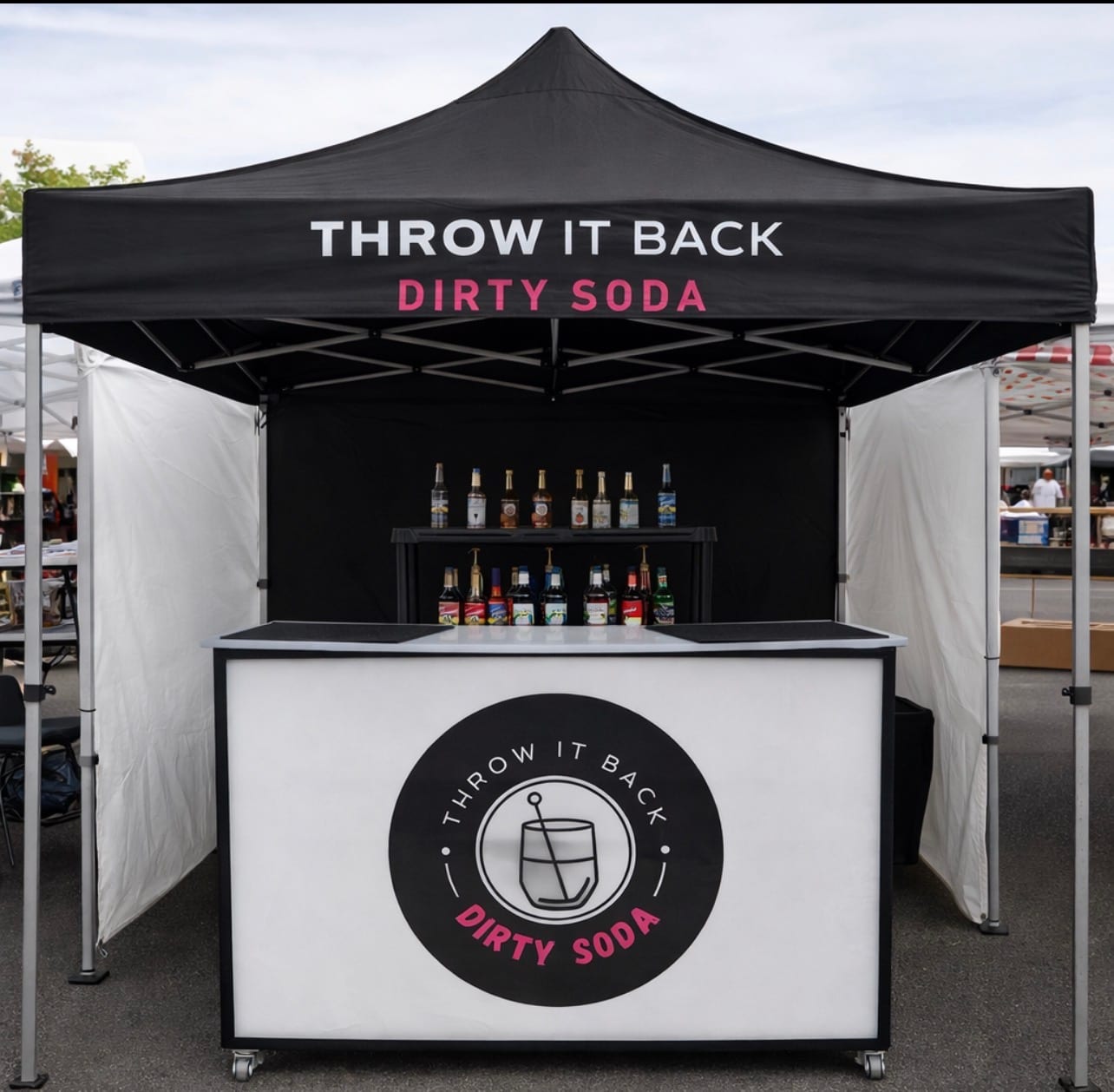 Throw It Back Dirty Soda — branded mobile soda bar setup with syrup display