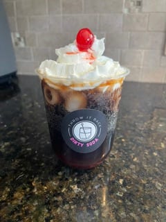 Cherry On Top — cola dirty soda with whipped cream and a cherry