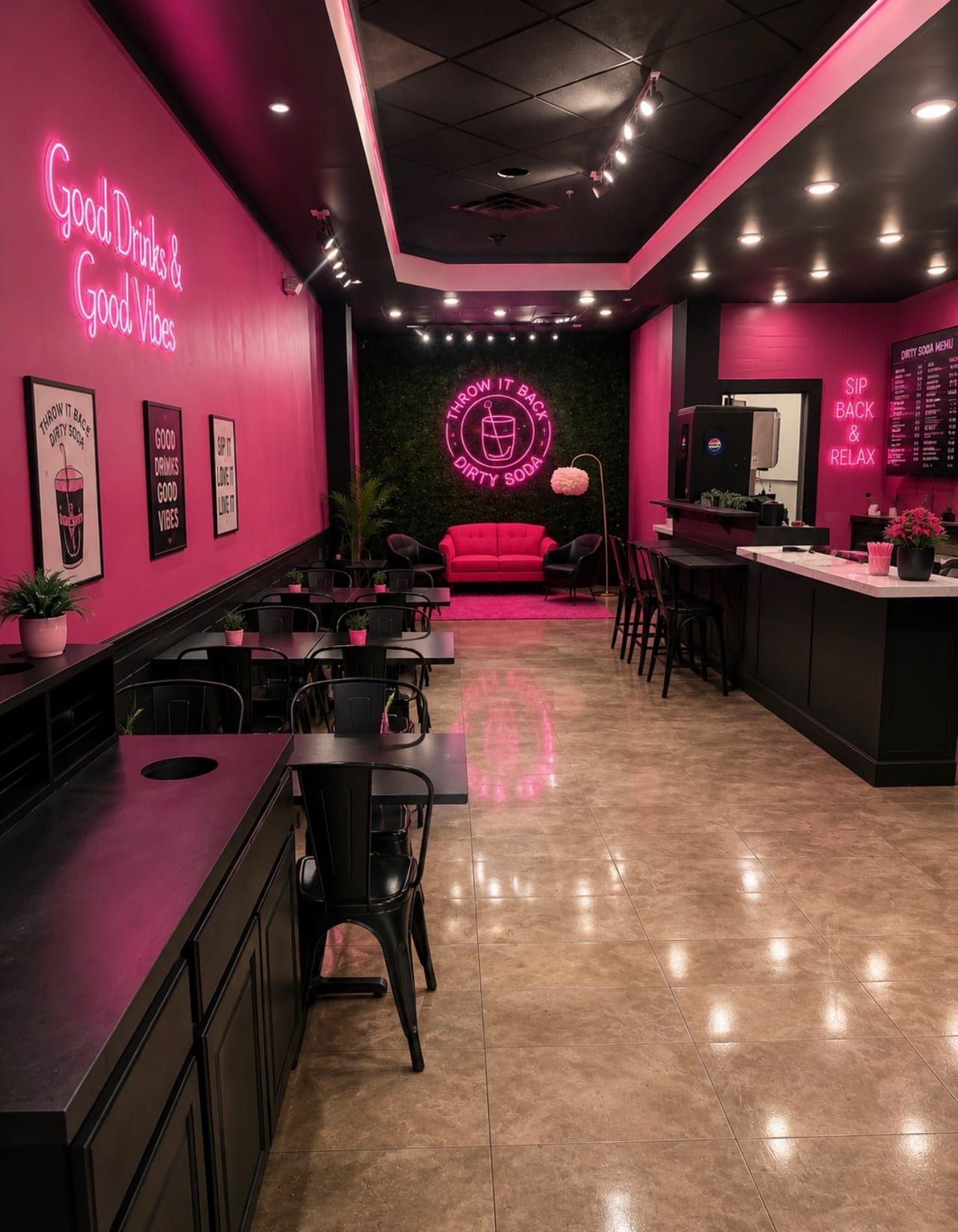 Inside the Throw It Back Dirty Soda shop — pink neon, seating, and the menu board